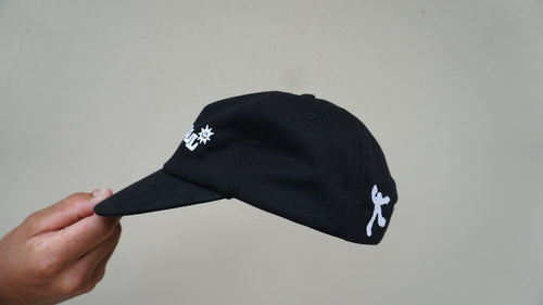 Side view of the black GOODCALL hat with white detailing