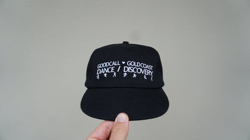 Front view of the black Discovery hat with white Dance / Discovery detailing